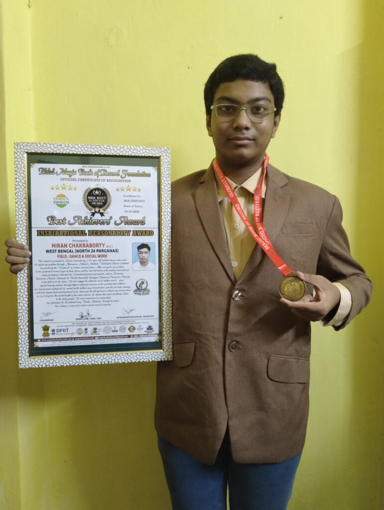 Hiran Chakraborty receiving the Best Achievers' Award and Inspirational Personality Award from Magic Book of Record Foundation.
